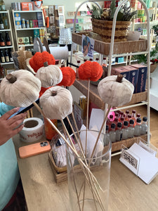 Faux pumpkin on a stick